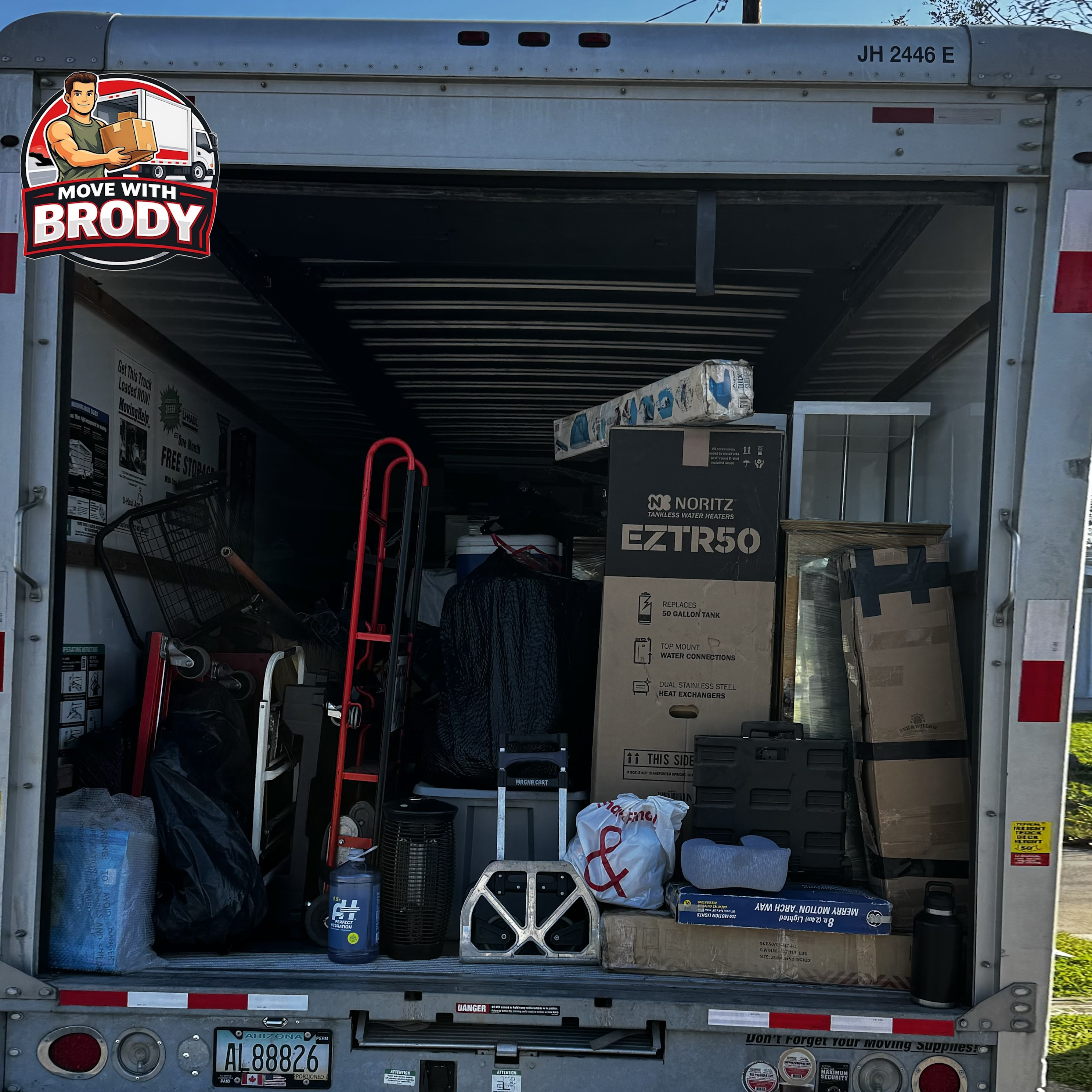 Move With Brody packed truck with moving boxes and appliances